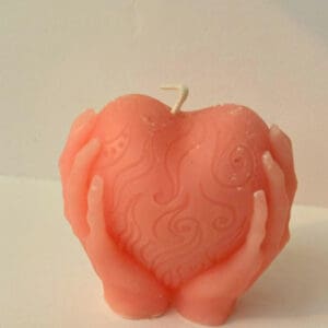 A candle that is shaped like an apple.